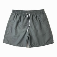 Nouveaux shorts de bain pour hommes en polyester 100% tissé, séchage rapide, couleur unie, style décontracté, pour l'été, vente en gros