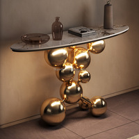 Mesa Consola de Diseño Moderno para el Hogar con Estructura Dorada y Tapa de Mármol en Forma de Elipse