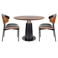 Table à manger ronde de style moderne du milieu du siècle, avec plateau en noyer et base en fer conique