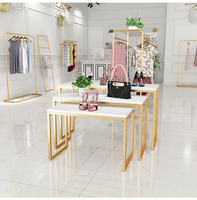 Ensemble table d'appoint imbriquée de conception de boutique porte-vêtements Table de présentation de porte-vêtements dorée pour boutique