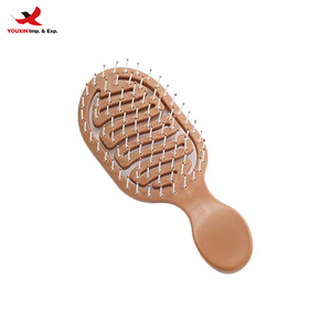 Brosse à cheveux en nylon compacte et mignonne, imperméable, à ions, de qualité supérieure, design creux pour cheveux volumineux et massage des méridiens - Product Image 1