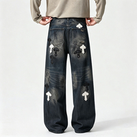 Jeans amples à coupe croisée de style américain haut de gamme pour hommes, avec patchs en cuir croisés et motifs brodés