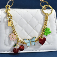 Pendentif de sac en alliage de zinc, motif cerise, papillon, trèfle, cœur, bicolore or et argent, ornement de sac fleur, porte-clés tendance