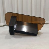 Table basse ovale avec plateau en verre fumé et base en acier inoxydable noir