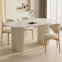 Ensemble table et chaises de salle à manger ovales en ardoise, style crème français, design minimaliste moderne pour petits appartements