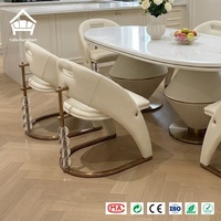 Ensemble de table à manger ovale de luxe avec accents en cristal et 6 chaises rembourrées, idéal pour l'ameublement de villas, hôtels et restaurants