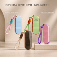 Boîte à pilules portable à 3 compartiments, étanche à l'humidité, organiseur de pilules hebdomadaire pour voyage avec cordon en silicone, vente en gros OEM