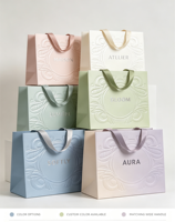 Sac à main d'emballage de boutique en papier artistique, fabriqué à la main, respectueux de l'environnement, en matériaux recyclés, avec procédé de gaufrage tridimensionnel