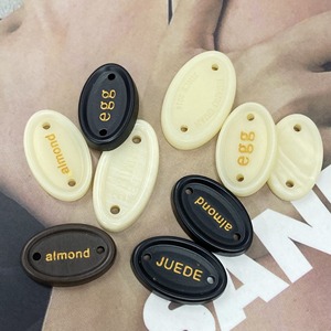 Tùy Chỉnh Thân Thiện Với Môi May Nút 2-Lỗ Nhựa Hình Bầu Dục Màu Trắng Mô Hình Vuông Thời Trang Phụ Kiện May Mặc Với Bow Nút Cho Quần Áo - Product Image 3