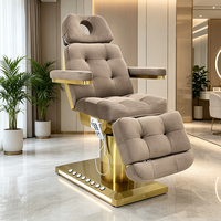 Table de massage électrique pour soins du visage avec base chauffante dorée, éclairage LED et commande au pied pour spa, salon de beauté et institut.