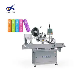 2024 Xiaoteng Stable quality horizontal labeler machine paper tube label applicator machine for tubes