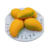 Balle anti-stress en latex pelucheux en forme de mangue, à récupération ultra-lente, jouet de décompression et anti-anxiété