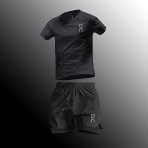 Set Sportivo Estivo Traspirante ad Asciugatura Rapida 100% Nylon con Maglia a Collo Tondo a Maniche Corte e Pantaloncini per Allenamento - Product Image 1