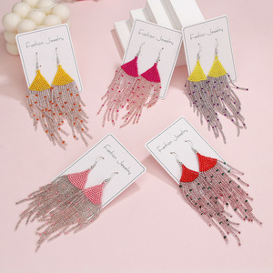 Boucles d'oreilles tissées Style bohème longue frange couleur perles de riz boucles d'oreilles pour femmes Uionen 1846 - Product Image 1