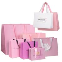 Sacs à vêtements en papier d'art de luxe écologiques avec logo personnalisé et poignées en corde/cordon de coton pour vêtements et sacs à parfum