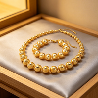 Parure de bijoux fantaisie pour femme en acier inoxydable, collier et bracelet à chaîne perlée, avec billes dorées graduées et sphères rondes polies