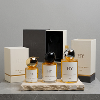 Flacon vaporisateur de parfum en verre cylindrique minimaliste 30ml 50ml 100ml personnalisable avec bouchon en forme de pierre