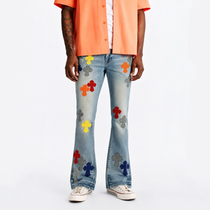 Jean en denim évasé vintage multicolore élégant avec patchs décoratifs et poches latérales pratiques pour le style streetwear et le hip-hop au quotidien - Product Image 1