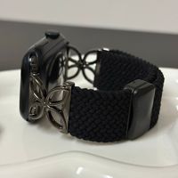 Bracelet de montre personnalisé en gros avec breloque trèfle à quatre feuilles, en nylon, ajustable, avec fermoir magnétique pour Apple Watch