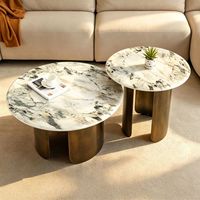 Table basse en dalle de roche ronde avec structure en acier inoxydable, mobilier moderne et minimaliste pour salon