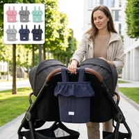 Sac de rangement pour poussette à pois marine avec volants, grand sac à couches à cordon de serrage, sac suspendu avec bouton-pression pour voyage de bébé et rangement pour maman
