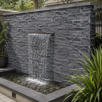 Revêtement mural extérieur UnionStone en pierre naturelle noire de haute qualité, moderne, durable et écologique, avec surface fendue