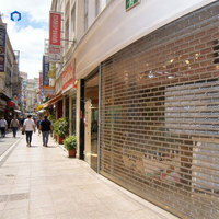 Porte commerciale pliante en PVC transparente antivol avec charnières en plastique, ouverture électrique pour usage en magasin