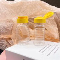 Bouteille de miel en plastique Transparent 108ml, bouchon jaune, grand pot de bouteille en verre, vente en gros