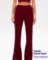 Pantalon large taille haute en nylon et élasthanne avec empiècements latéraux contrastants, idéal pour le sport et le style décontracté automne-hiver