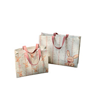 Sac cadeau robuste en non-tissé DLBZ avec motif de lapin de dessin animé mignon, logo personnalisé, sac de shopping de luxe, sac fourre-tout en tissu réutilisable