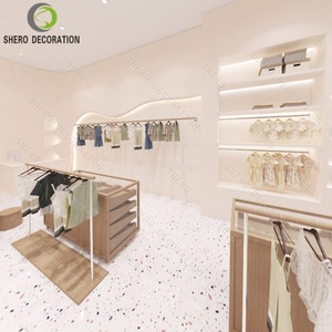 Diseño Moderno para Tienda de Bebés, Exhibidor de Ropa Metálico de Pared, Personalizable y Duradero, Muebles para Tienda de Ropa de Lujo - Product Image 1