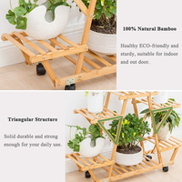Support mobile à 4 niveaux et robuste pour décoration de jardin en bambou naturel avec roulettes, étagère pour pots de fleurs.