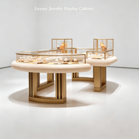 Vitrine de présentation de bijoux ronde de luxe, cadre en métal doré, dessus en verre, comptoir d'îlot pour bijoux avec plateaux de présentation, boutique personnalisée