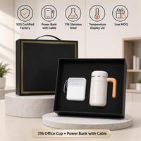 Batterie externe 4-en-1 de 10000 mAh avec câbles intégrés, charge rapide, universelle, et couvercle intelligent avec affichage de la température pour tasse de bureau 316, idéal comme cadeau.