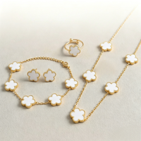 Vente en gros de bijoux en acier inoxydable multicolores, ensemble de 4 pièces, collier, boucles d'oreilles, bracelet, bague, cadeau pour femme, petite amie