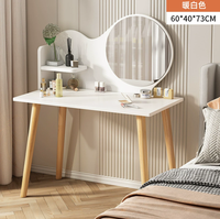 Coiffeuse moderne simple de luxe avec miroir de maquillage rouge en filet adapté à un petit appartement léger