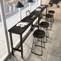 Table de bar industrielle longue en bois massif carbonisé noir avec structure métallique pour café, restaurant, maison, côté fenêtre