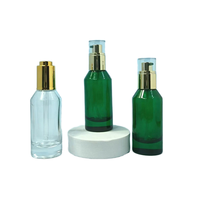 Crème pour le visage verte 50 ml et huile essentielle en flacon en verre avec pulvérisateur à pompe, diffuseur de parfum rond transparent