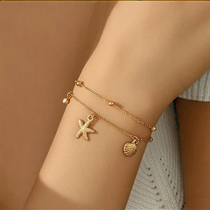 Elegante Brazalete Chapado en Oro Real de 18K Hecho de Acero Inoxidable 304 con Incrustaciones de Circonita en Forma de Estrella de Mar y Concha de Doble Capa - Product Image 1