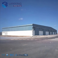 Bâtiment d'entrepôt et d'atelier commercial moderne à grande portée avec système de charpente en acier préfabriqué et support de poutre de grue