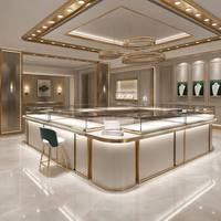 Solution complète de design d'intérieur pour bijouterie de luxe beige et or, avec comptoir d'exposition incurvé en verre sur mesure pour îlot de bijoux