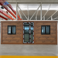 Maison modulaire en conteneurs moderne avec structure coordonnée et multiples fenêtres pour projets résidentiels haut de gamme et maisons d'hôtes