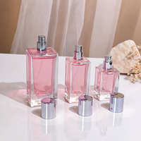Flacons de parfum en verre transparents de luxe personnalisés de 100 ml et 50 ml avec bouchon de parfum, pulvérisateur et boîte personnalisée