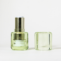 Tube de rouge à lèvres vide vert transparent rond de conception unique Mini emballage de bouteille de baume à lèvres avec applicateur