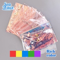 Sac cosmétique en PVC plastique coloré à la mode, sac cosmétique transparent holographique avec fermeture éclair blanche