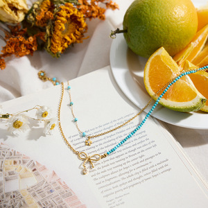 Collier pendentif en acier inoxydable avec perles turquoise bleues, design nœud papillon, bijoux cadeau - Product Image 4