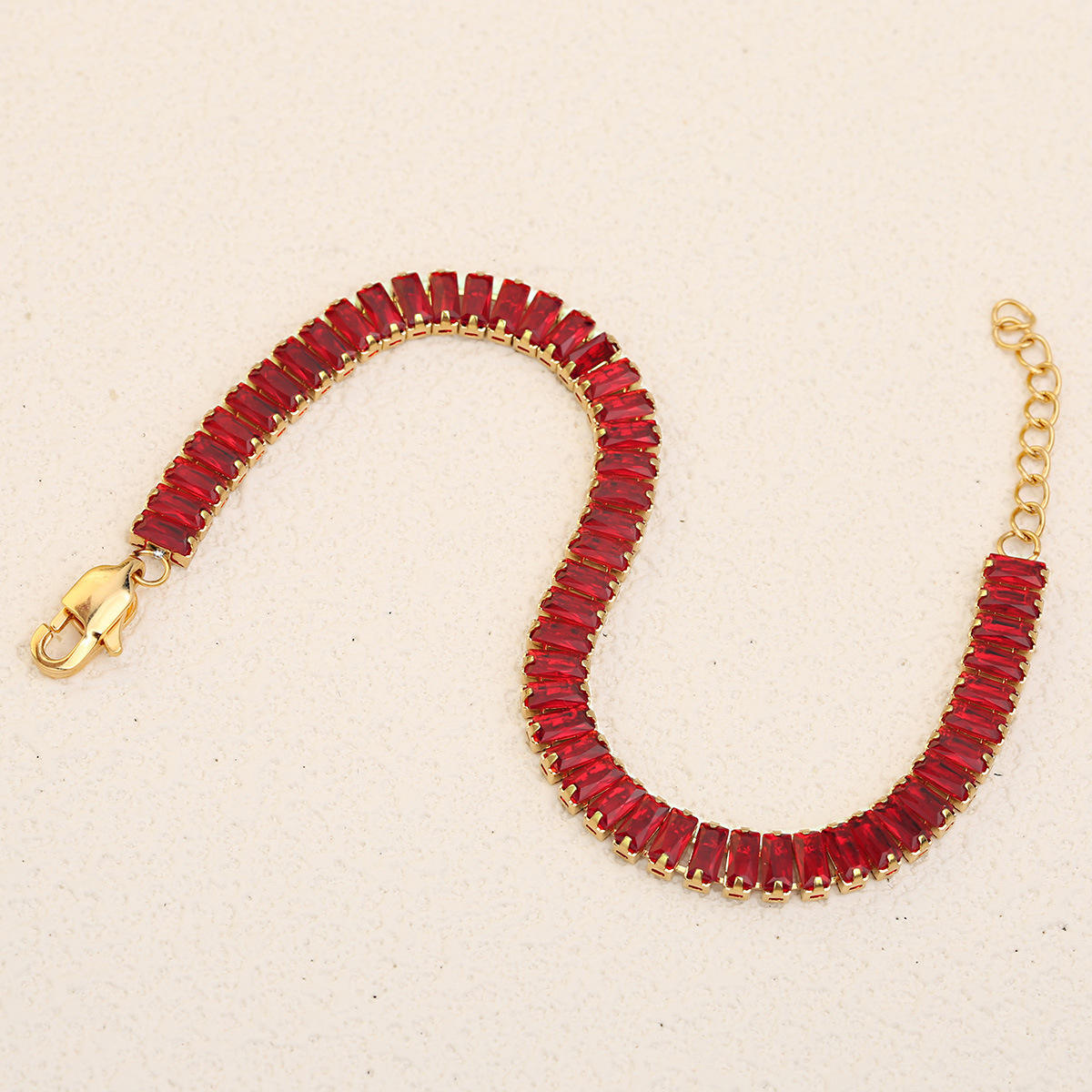 สร้อยข้อมือพลอยเทียมสีแดงทอง