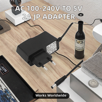 Adaptor Daya CE FCC Rohs AC 100-240V ke DC 12V 1A 2A dengan Colokan UK/UA/EU/AU untuk Lampu LED Adaptor Dinding dengan 5.5*2.5mm