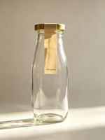 Vente en gros de bouteilles en verre transparent de 300 ml avec bouchons à vis pour jus, eau, lait, thé, boissons