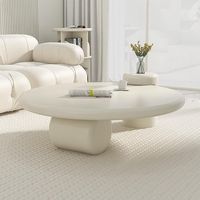 Table basse ronde style crème Voyage pour petit appartement, design artistique haut de gamme, salon moderne, design français simple pour la maison